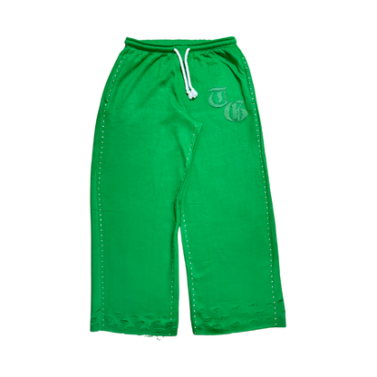 Green front view of TG Rhinestone oversized, distressed rhinestone sweatpants. 