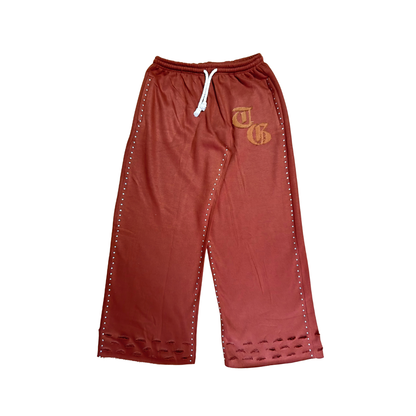 Brown front view of TG Rhinestone oversized, distressed rhinestone sweatpants. 