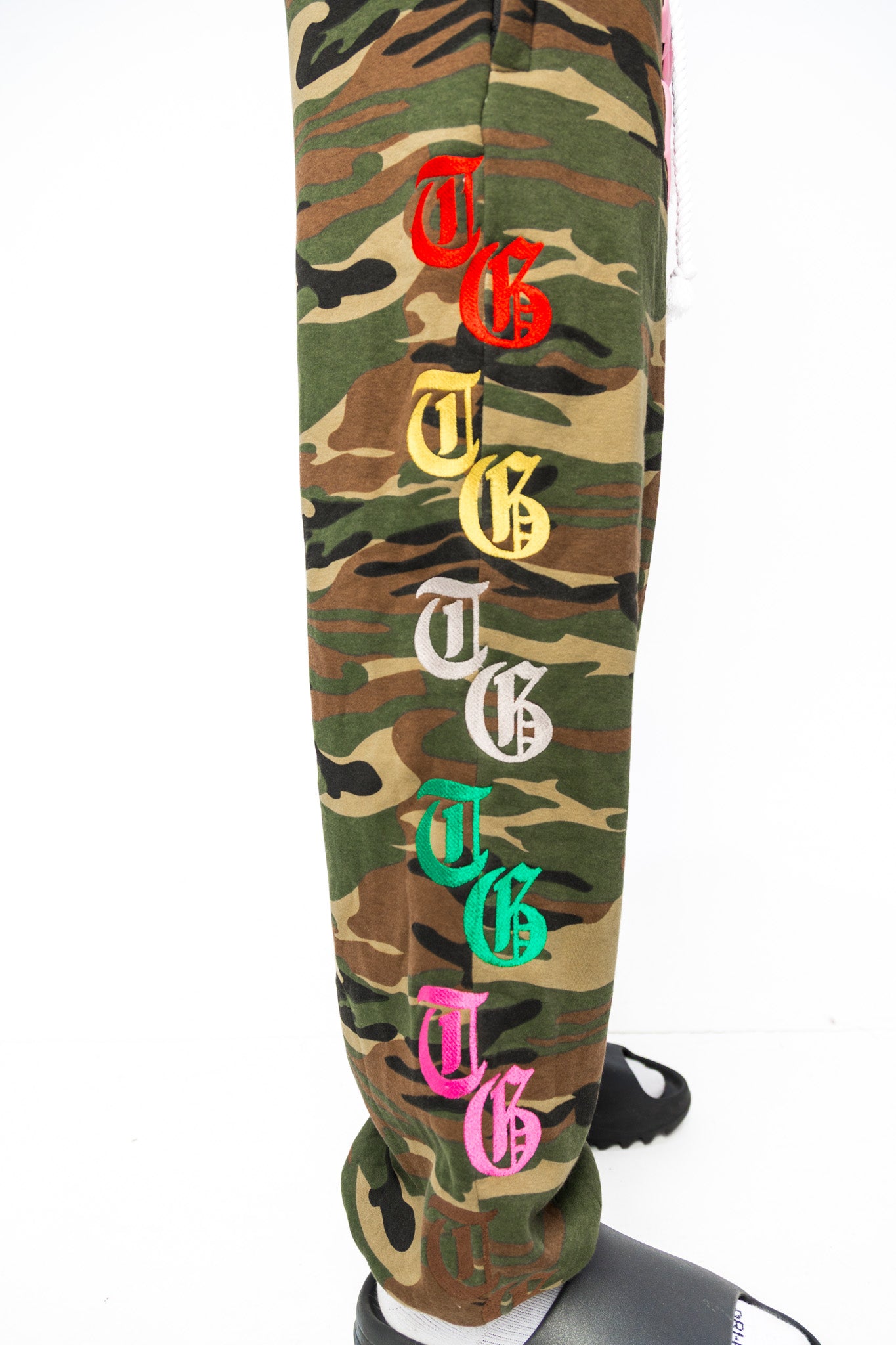 Side view of Third Gen Camo oversized sweatpants.