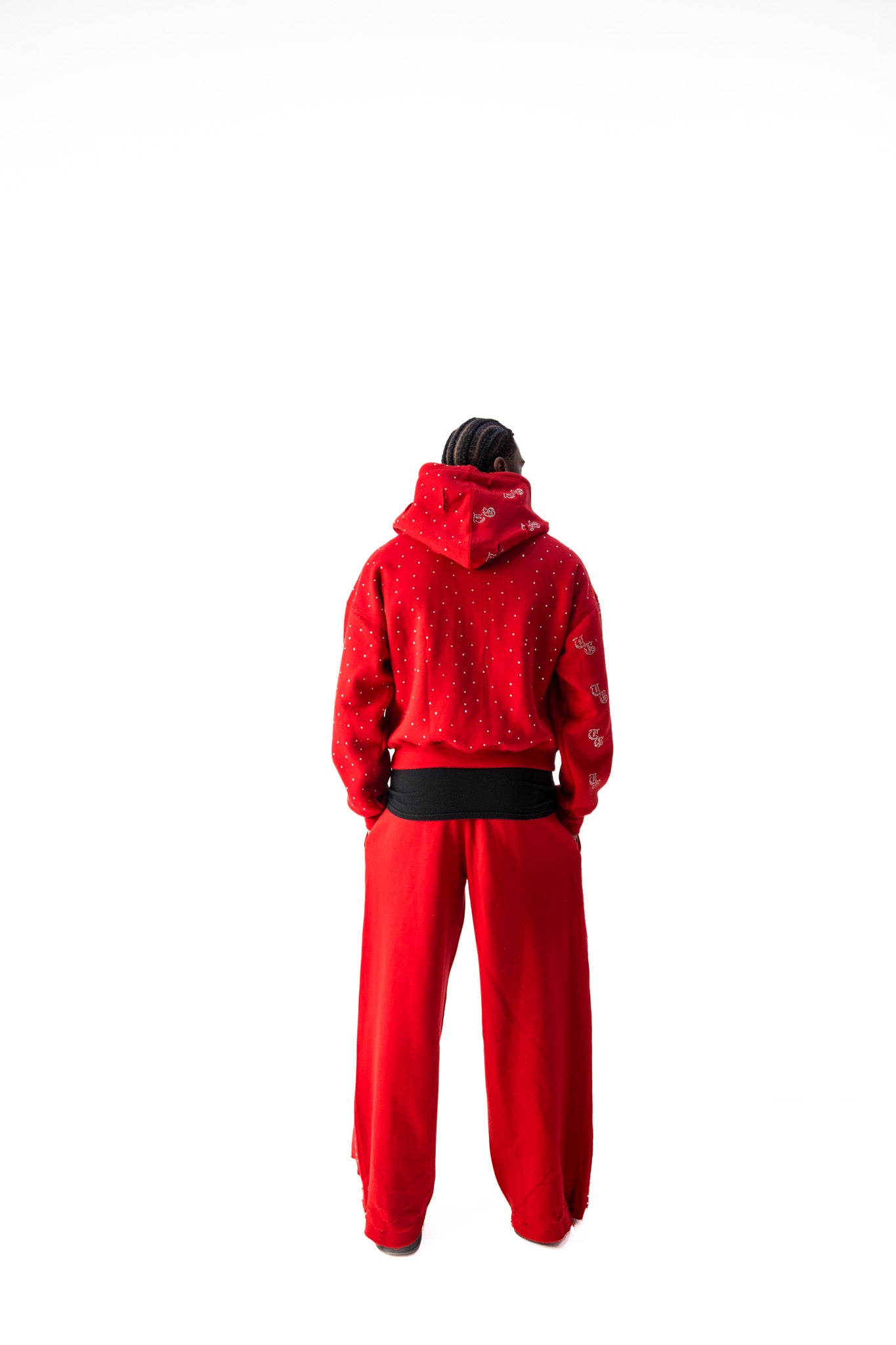 Red back model view of TG Rhinestone oversized, distressed rhinestone sweatpants. 