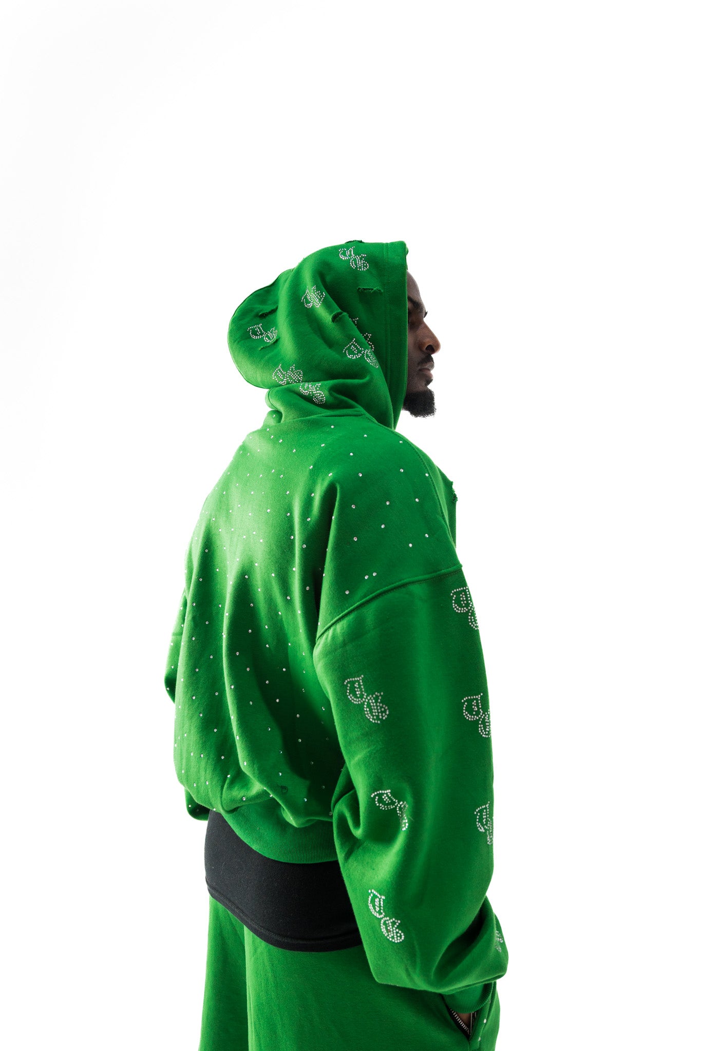 Green model back view of TG Rhinestone oversized, distressed, cropped, rhinestone jacket.