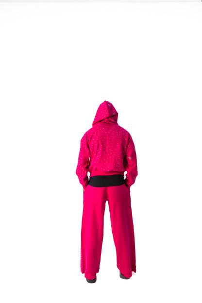 Pink model back view of TG Rhinestone oversized, distressed rhinestone sweatpants. 