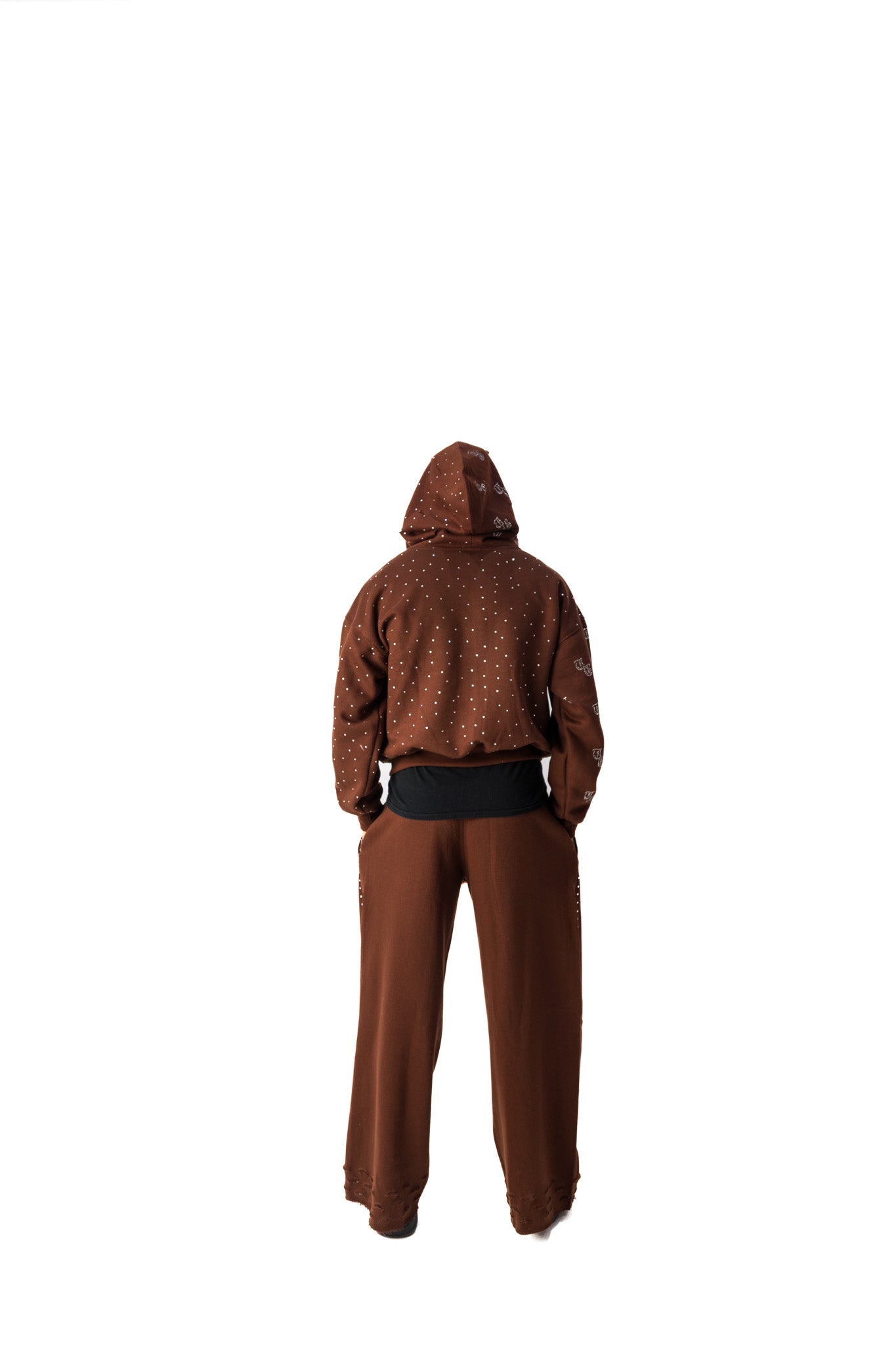 Brown model back view of TG Rhinestone oversized, distressed rhinestone sweatpants. 