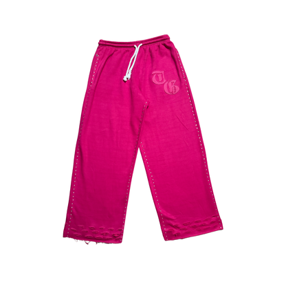 Pink front view of TG Rhinestone oversized, distressed rhinestone sweatpants. 